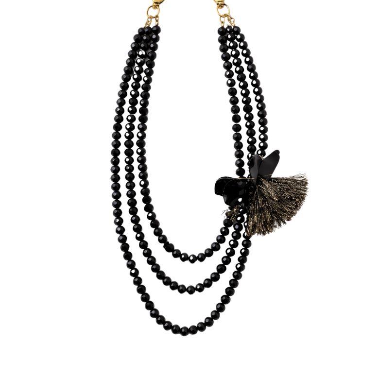 Elegant three-strand necklace with faceted black beads and a delicate flower and tassel accent, perfect for adding sparkle.