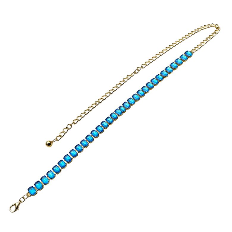 Cintura gioiello acciaio dorato con pietre azzurre grandi. Accessorio moda elegante e raffinato.
