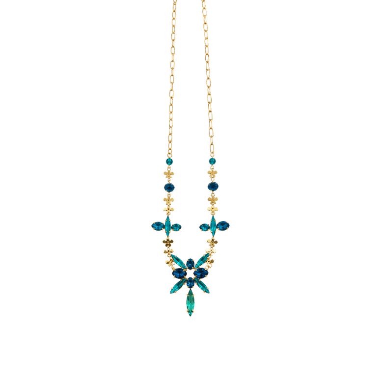 Collana acciaio dorato con cristalli blu e turchesi, design floreale elegante.